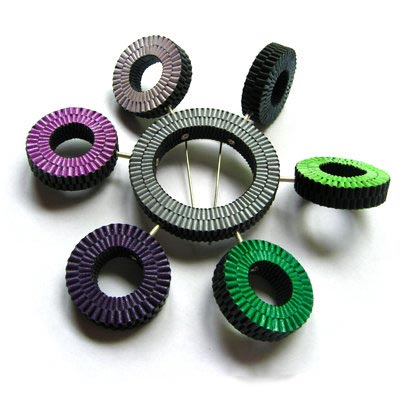 Satelliti brooch